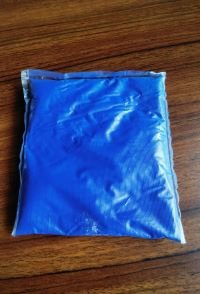 Blue dye powder in a water-soluble pack
